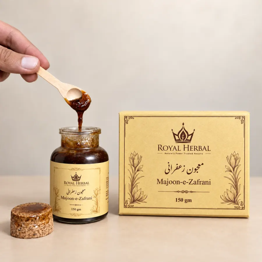 An open jar of Majoon-e-Zafrani with a wooden spoon lifting a spoonful, beside its gold 150 gm presentation box