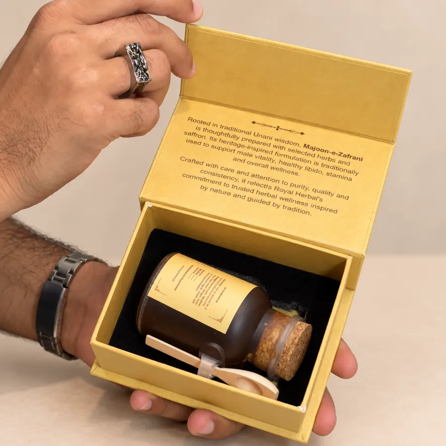 The Royal Herbal presentation box held open, the jar and its wooden spoon fitted inside